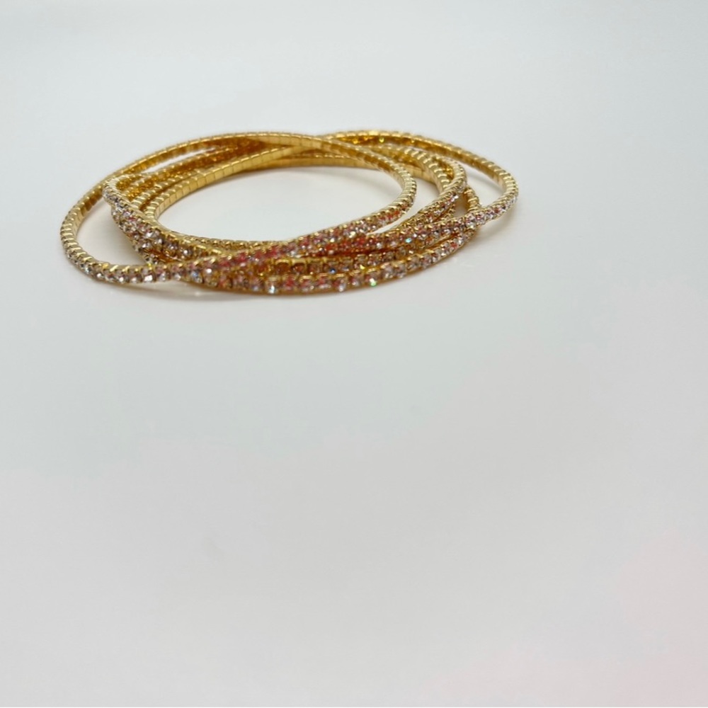 Women’s gold studded bangles.